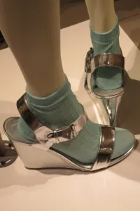 Chrome colored wedge shoes with buckle over green socks on a mannequin at the entrance to Nordstrom SF. Photo by BF Newhall