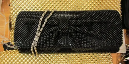 an evening handbag that's pretty and big . A black beaded evening bag for sale at Macy's for $40.