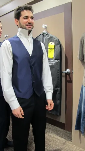 Purple vest and ivory shirt for the groom at Men's Wearhouse