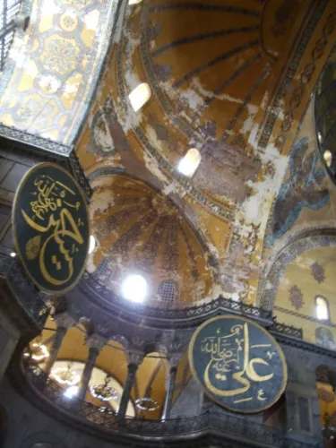 hagia-sophia-with-two-Arabic-rondels Two rondels hang high on the walls of the ancient Hagia Sophia basilica. By BF Newhall