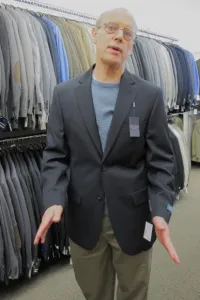 Father of the groom trying on coat for the wedding at Men's Wearhouse Emeryville, CA. Photo by BF Newhall