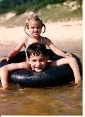 Peter and Christina in the little beach at the outlet aboard a classic inner tube. Photo by Barbara Newhall