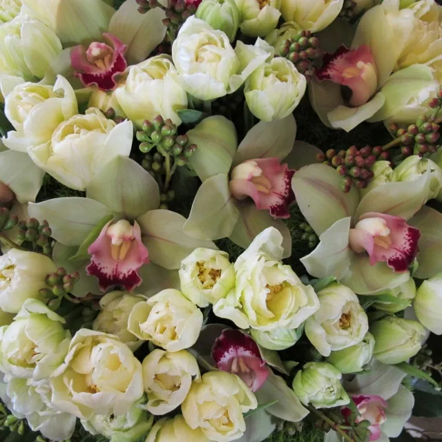 Floral arrangement with white tulips, pink and white orchids. Photo by Barbara Falconer Newhall.