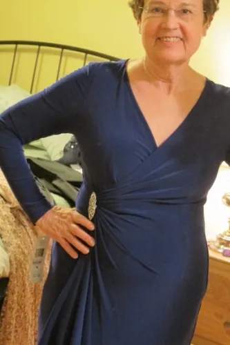 my-mother-of-the-groom-dress A woman wearing a purple V-necked jersey gown with rhinestone embellishment. Photo by BF Newhall