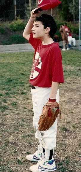kids who cheat. Peter Newhall lifts his baseball cap during practice. Photo 1991 by BF Newhall