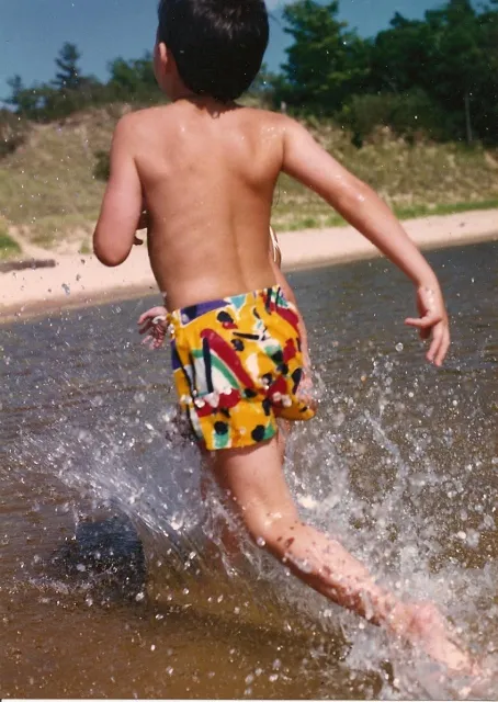 little boy at a little beach in michigan. photo by barbara newhall