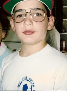 Eleven-year-old boy with glasses and a bump on his lip. Photo by BF Newhall
