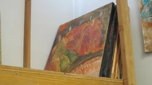 A painting tucked away in the back of Salma's studio. Red and green with human figures suggested. Photo by BF Newhall