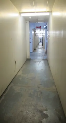 Narrow hallway in the Sawtooth Building, which houses artists' studios in Berkeley, ca.  Photo by BF Newhallwtooth building, 2547 Eighth St. Berkeley