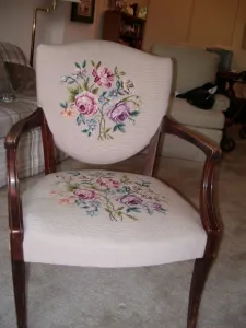Side chair with pink floral needlepoint. Photo by BF Newhall