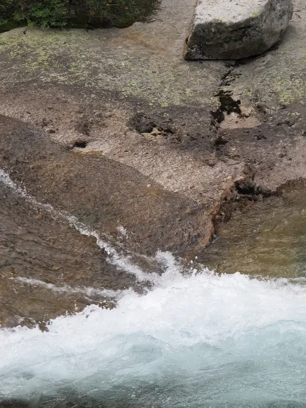 Water splashing over rocks along Merced River Yosemite. Photo by BF Newhall
